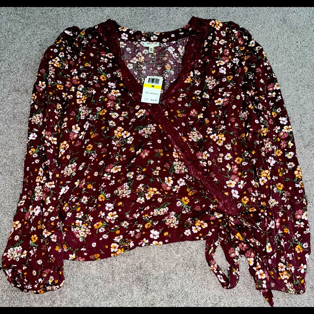 This shirt is a new shirt with the tag and size medium the colors, nice